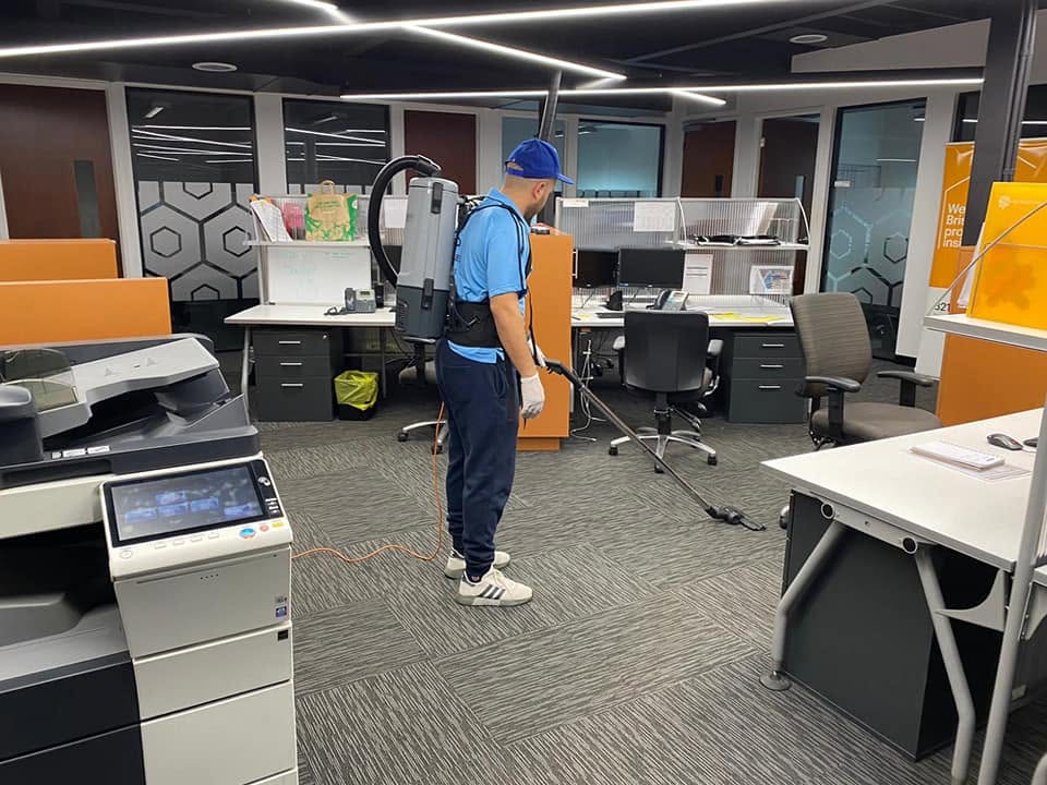 Backpack vacuuming a Brisbane office
