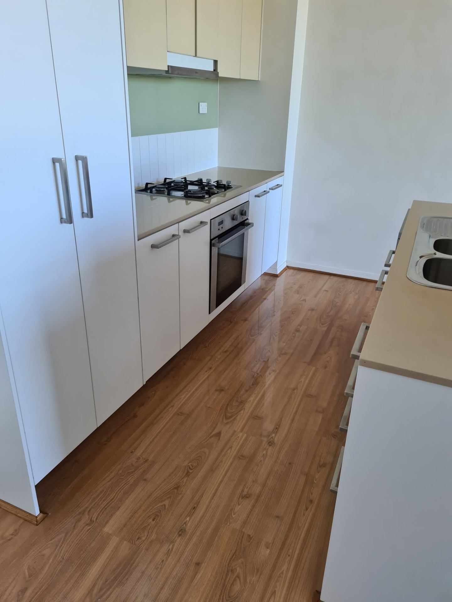 Empty Brisbane rental kitchen cleaned to handover standard